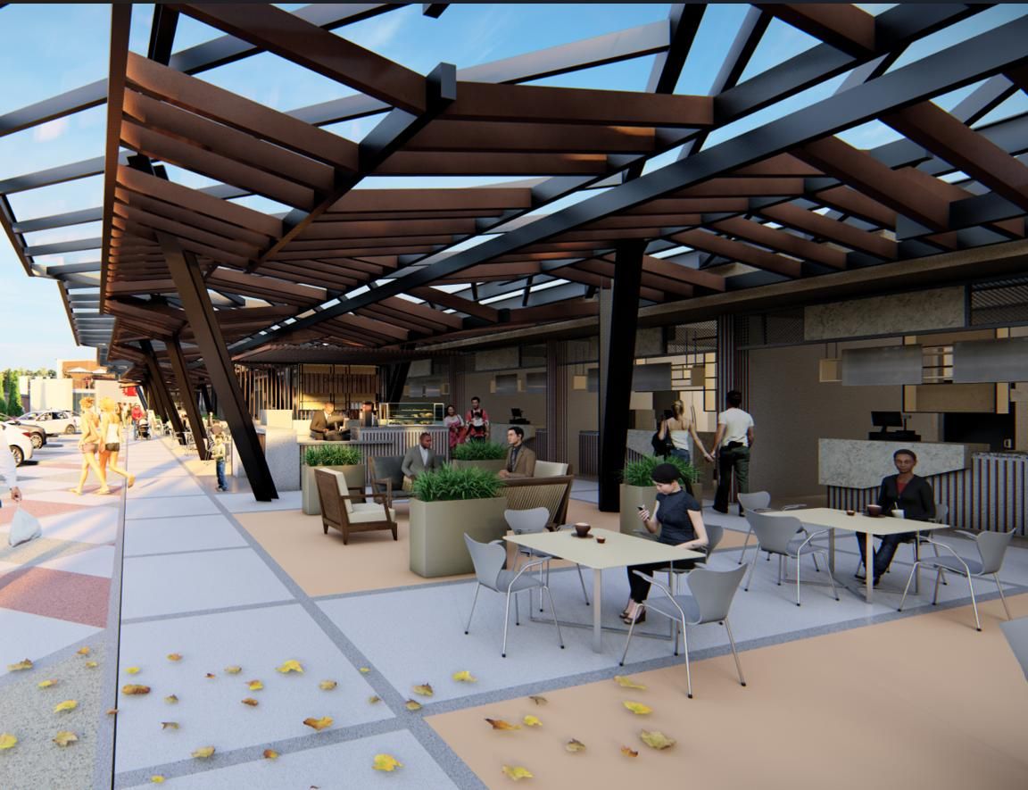 Terraza y zona de caf&eacute; bajo la p&eacute;rgola